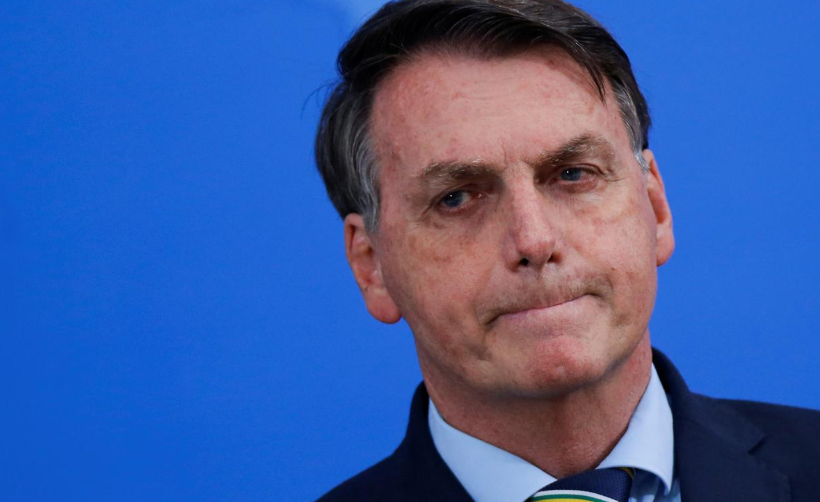 Brazil's President Jair Bolsonaro reacts during a media statement to announce the new Minister of Health, Nelson Teich, amid Covid-19 outbreak, in Brasilia, Brazil, April 16. — Reuters
