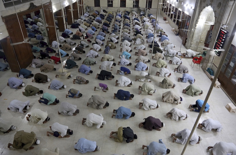 People attend evening prayers while maintaining distance to help prevent the spread of the novel coronavirus at a mosque in Karachi, Pakistan, on Sunday, April 19, 2020. A day earlier, President Dr Arif Alvi had announced that neither the state machinery nor clerics would stop citizens from visiting mosques as almost all demands of clerics related to holding of Friday, Tara&shy;weeh and daily congregational prayers were acc&shy;epted with the condition of social distancing and other precautionary measures. &mdash; AP