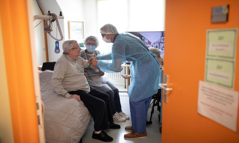 Henry Voortmann has a test for COVID-19 by medical staff from a laboratory at a nursing home in Ammerschwir, France. &mdash; AP
