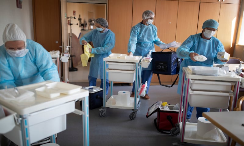 Medical staff from a private laboratory arrive to test the residents at a nursing home in Kaysesberg, France. &mdash; AP
