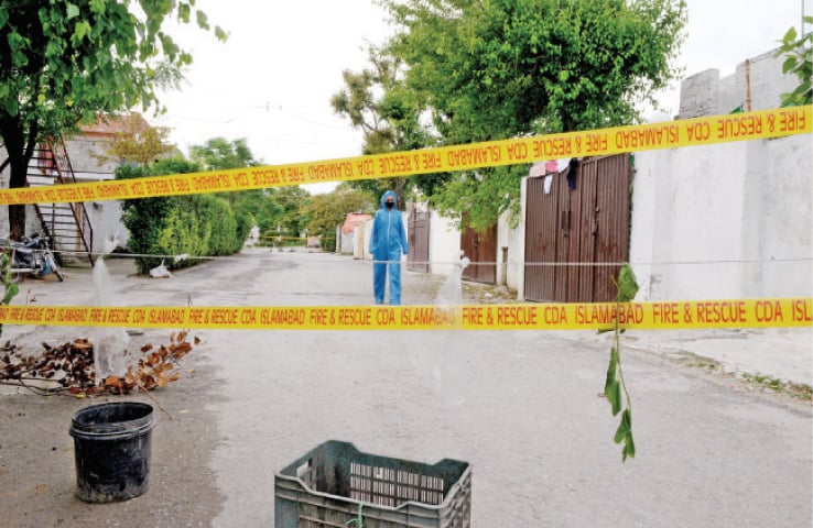 A street in G-6 has been sealed after seven cases were reported from a house on Sunday. &mdash; Photo by Mohammad Asim