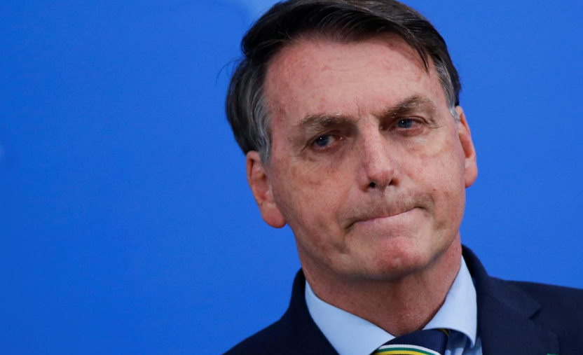 Brazil's President Jair Bolsonaro reacts during a media statement to announce the new Minister of Health, Nelson Teich, amid Covid-19 outbreak, in Brasilia, Brazil, April 16. &mdash; Reuters