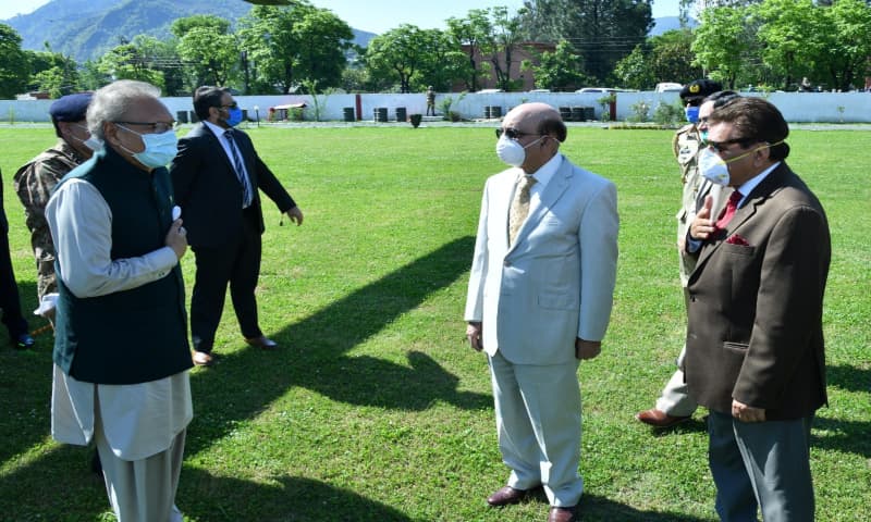 AJK president, prime minister and President Alvi avoid handshakes on the latter's arrival in Muzaffarabad.