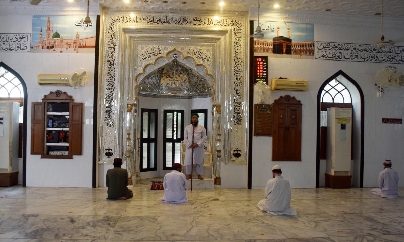 A limited number of people pray at a mosque in Hyderabad. &mdash; Photo Umair Ali