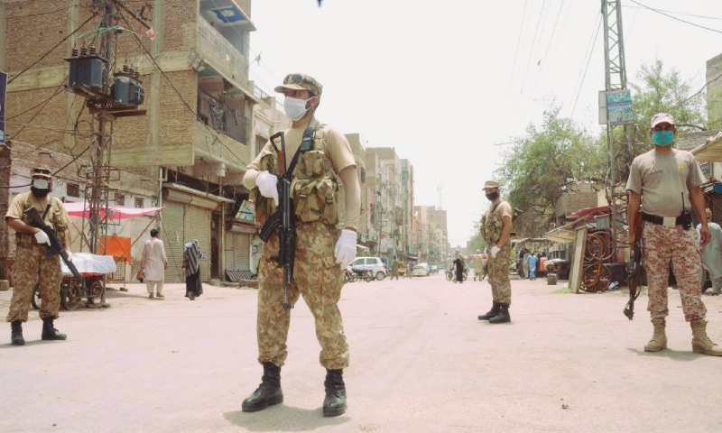 Uniformed security personnel in Hyderabad enforce a stricter lockdown during Juma prayer timings.—PPI Uniformed security personnel in Hyderabad enforce a stricter lockdown during Juma prayer timings.—PPI
