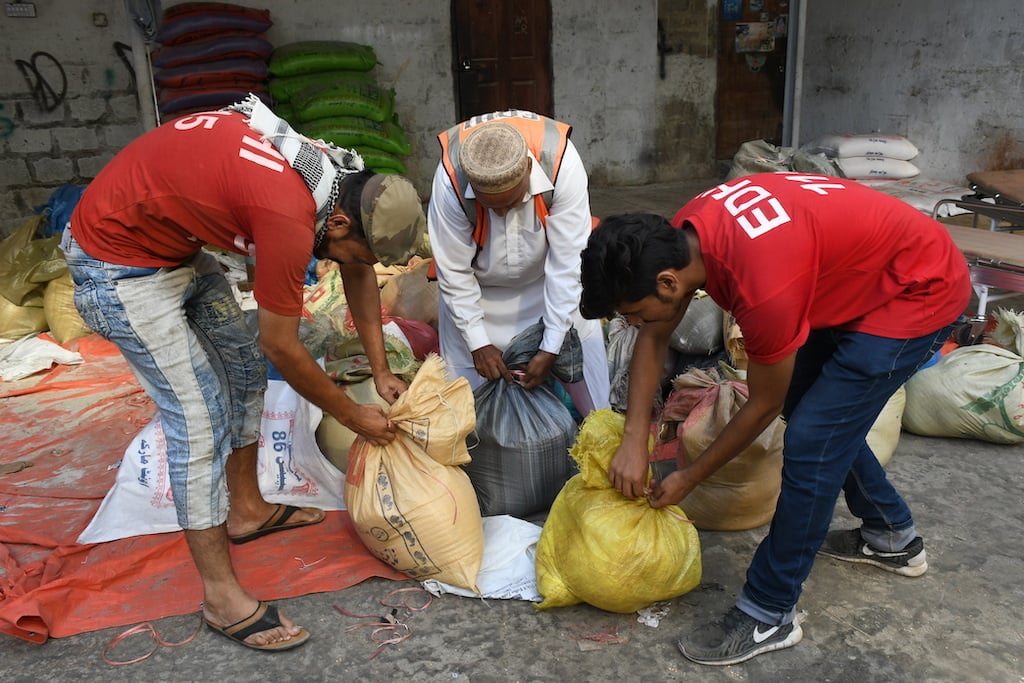 Volunteers pack rations | Faysal Mujeeb/White Star