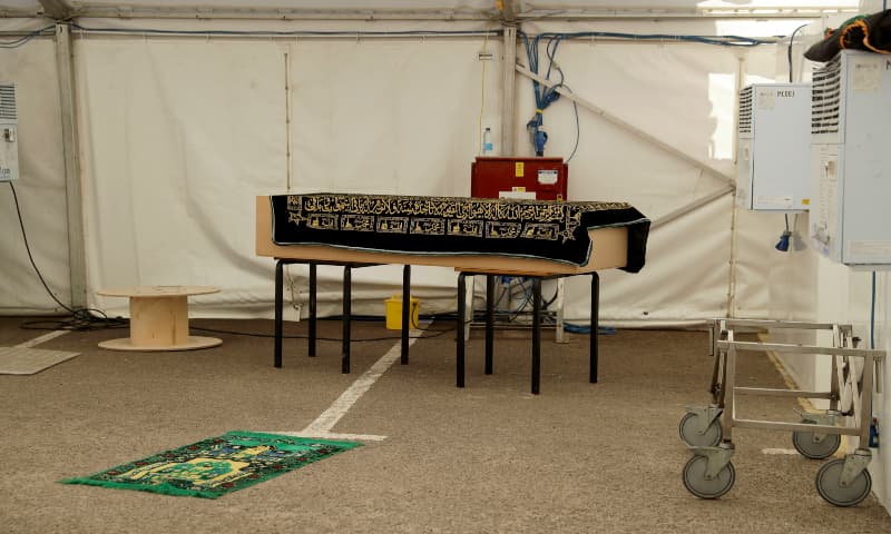 In this photo taken on April 24, 2020, a view of a coffin containing the body a victim of Covid-19 placed on tables prior to a burial. — AP