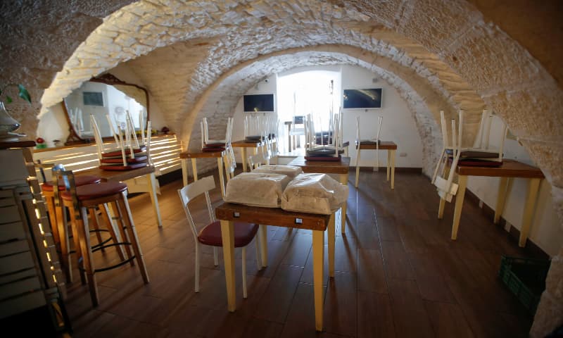An empty “20mq Panini e Poi” restaurant is pictured in the small southern historical town of Cisternino, Italy on April 4. — Reuters An empty “20mq Panini e Poi” restaurant is pictured in the small southern historical town of Cisternino, Italy on April 4. — Reuters
