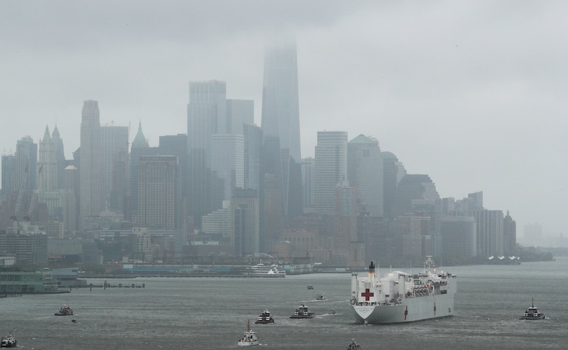 The US Navy hospital ship USNS Comfort heads past lower Manhattan and the World Trade Center building under heavy fog as it leaves to return to its home port of Norfolk, Virginia, after treating patients during the outbreak of coronavirus disease in New York City, New York, US, on April 30, 2020. — Reuters
