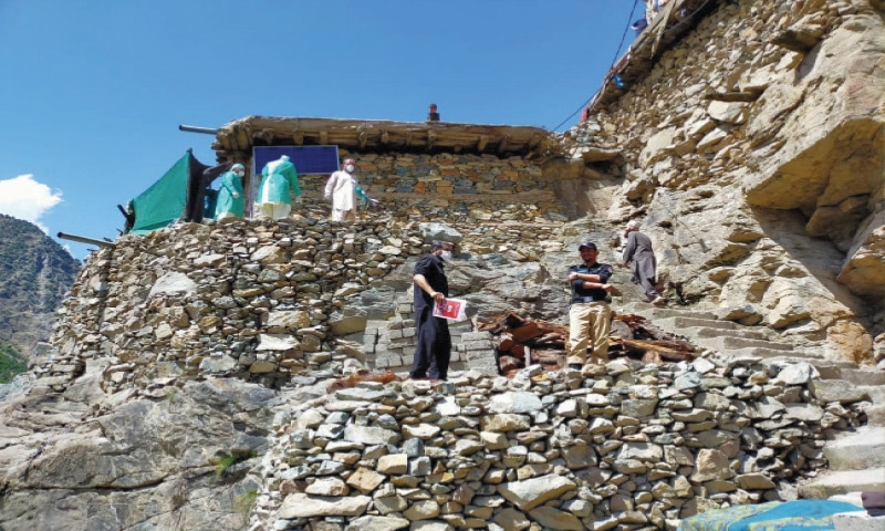 EPI technicians collecting samples for Covid-19 test in a hard area of Dasu, Upper Kohistan. — Dawn photo