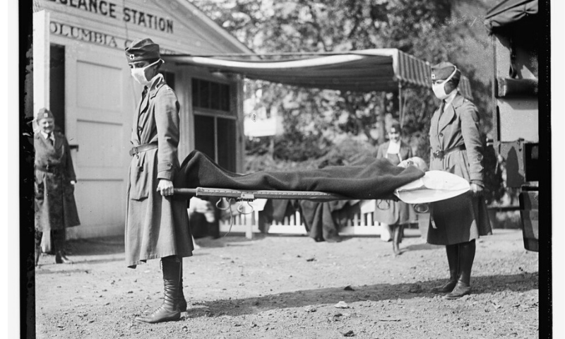 This Library of Congress photo shows a demonstration at the Red Cross Emergency Ambulance Station in Washington, DC, during the influenza pandemic of 1918. — AP