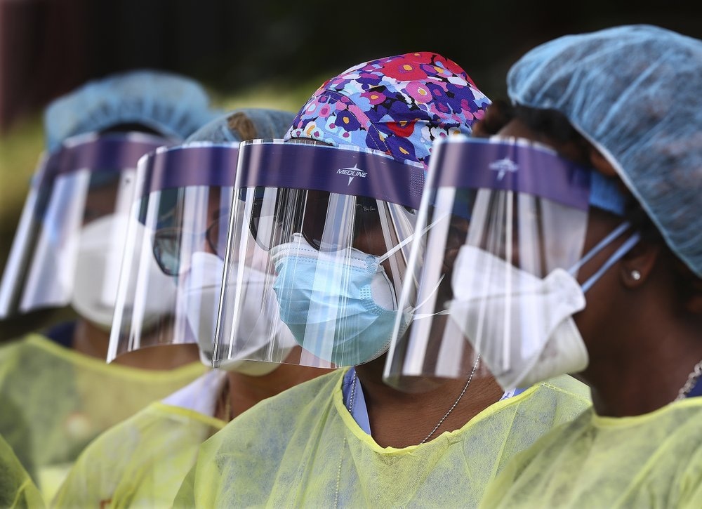 In this May 4 file photo, volunteers line up to begin taking hundreds of free Covid-19 tests at a pop-up site at the House of Hope in Decatur, Georgia, US. — AP