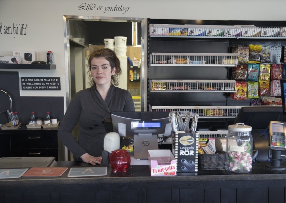 Margret Gudjonsdottir, 28, poses for a photo as she works alone at a roadstop in Hvammstangi, Iceland. High schools, dentists and hair salons are about to reopen in Iceland, which has managed to get a grip on the coronavirus through the world&rsquo;s most extensive regime of testing, &mdash; AP