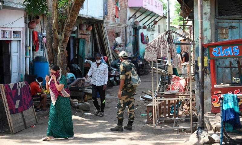 A paramilitary soldier from the Border Security Force keeps vigil during a government-imposed nationwide lockdown in Ahmedabad on May 8. — AFP