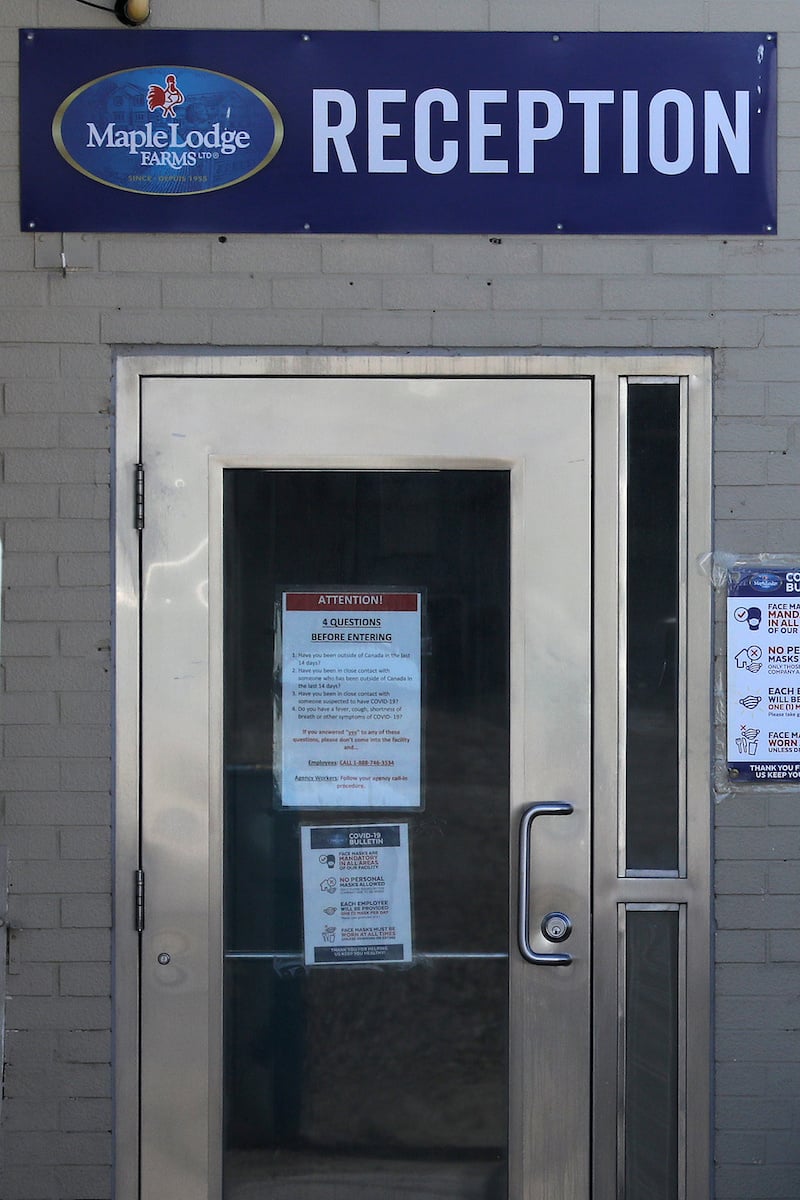 A sign instructs personnel to declare if they are at risk of infection, at the reception door of the Maple Lodge Farms chicken processing plant after the company said one worker had died and 25 tested positive for the coronavirus in Brampton, Ontario, Canada on May 7, 2020. — Reuters