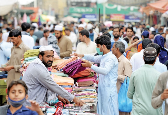 A large number of people throng Rawalpindi’s Bara Market on Friday. — Photo by Mohammad Asim