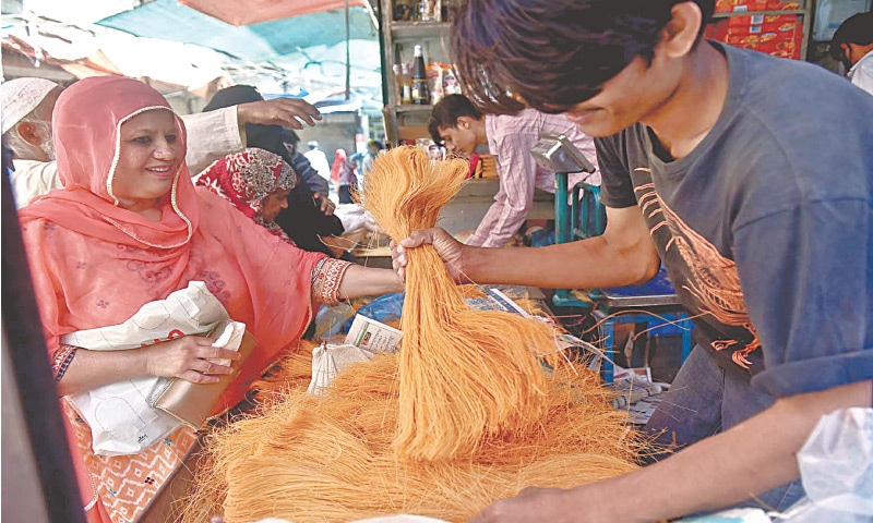 Though Eidul Fitr is still two weeks away, shopping for vermicelli, consumed with relish on the festival, has picked up pace, as seen here in a Liaquatabad shop on Saturday. — Fahim Siddiqi/White Star Though Eidul Fitr is still two weeks away, shopping for vermicelli, consumed with relish on the festival, has picked up pace, as seen here in a Liaquatabad shop on Saturday. — Fahim Siddiqi/White Star