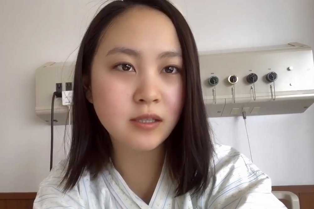 In this April 15, 2020, image made from the Youtube account of Arisa Kadono, she speaks to her smartphone video at a hospital, in Himeji, western Japan
