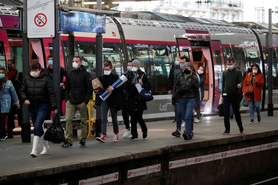 Commuters, wearing protective face masks, walk on a platform at the Saint-Lazare train station in Paris, on the first day mask usage is mandatory in public transport, after France begun a gradual end to a nationwide lockdown due to Covid-19 on May 11. &mdash; Reuters