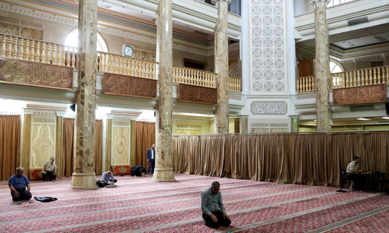 In this April 2020 file photo, Iranian worshippers pray as they keep social distancing at a mosque following the coronavirus outbreak in Tehran, Iran. &mdash; Reuters