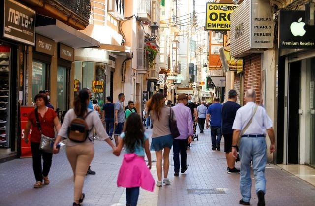People walk the street amid Covid-19 outbreak in downtown Palma de Mallorca, Spain, May 11. — Reuters