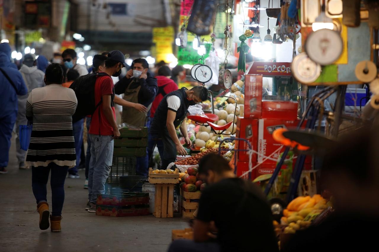 People are pictured at the Central de Abastos, one of the world's largest wholesale market complexes, amid Covid-19 outbreak in Mexico City, Mexico, May 11. &mdash; Reuters