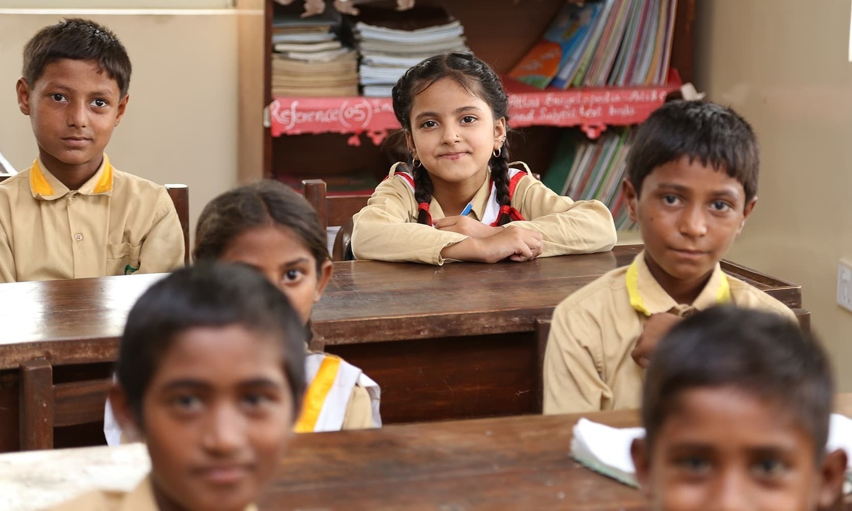 Students look into the camera during a cllass at the TCF Gambat school. - Photo by Mustafa Ilyas