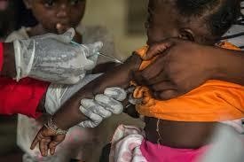 A toddler in DR Congo gets a measles jab. — AFP