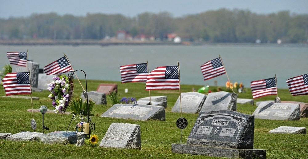 American flags fly over the graves of veterans on May 19, a few days before Memorial Day, at Lakeside Cemetery in Erie, Pennsylvania. — AP