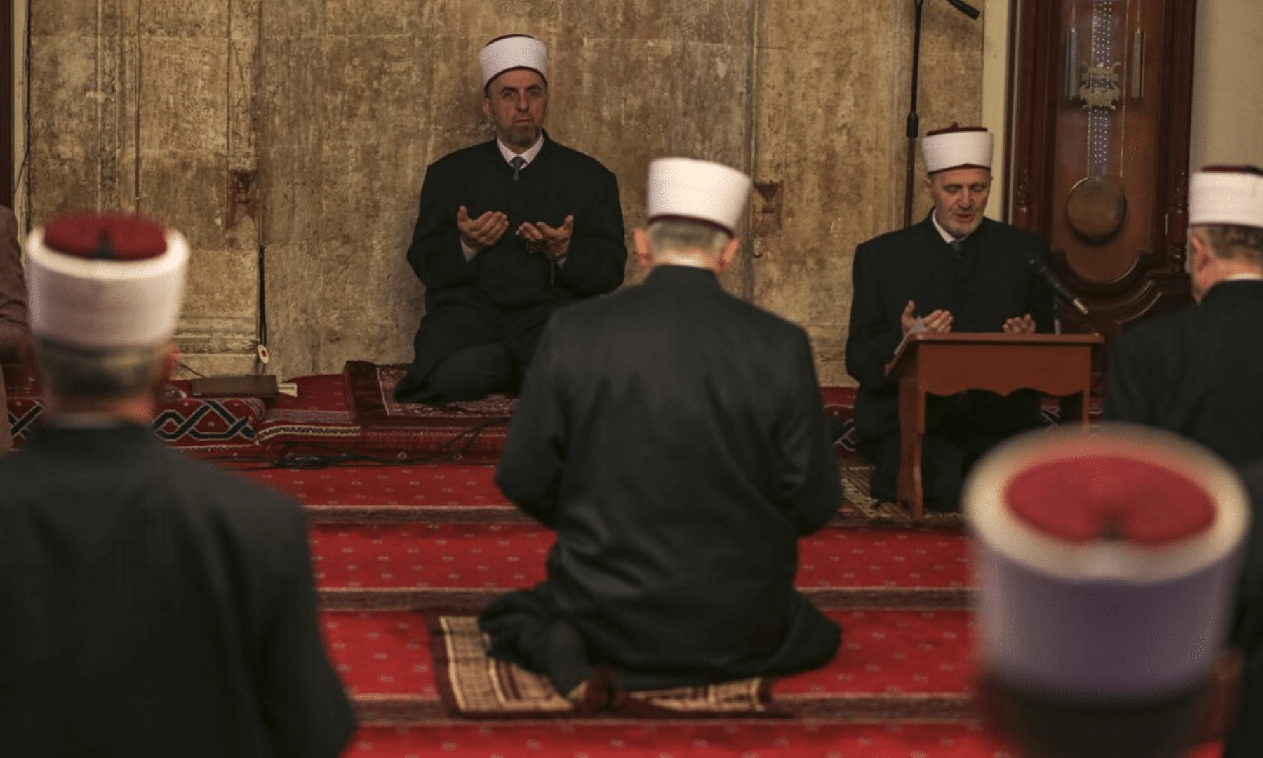 Kosovo's grand mufti Naim Ternava, left rear, leads the Eidul Fitr prayer at the grand mosque in Pristina, Kosovo. Kosovo's mosques have been closed since March 14 because of the spread of Covid-19. — AP