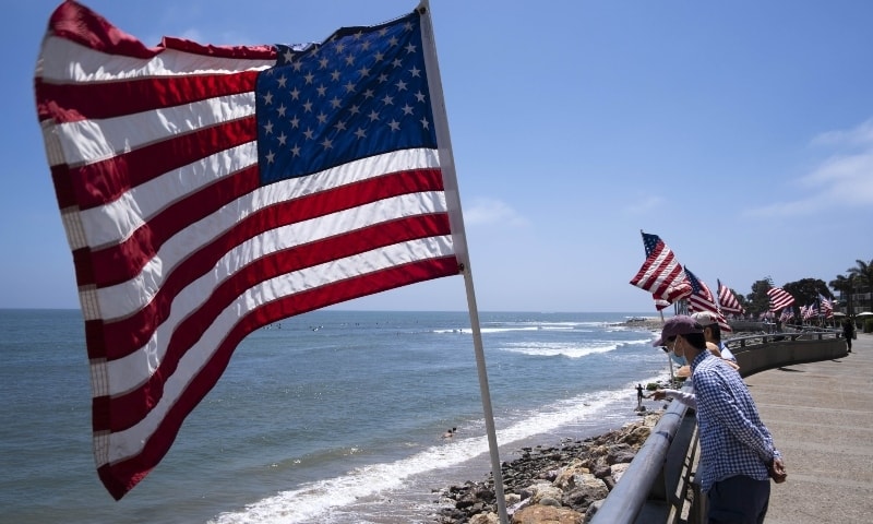 People enjoy the less restricted beachfront over Memorial Day weekend May 24 in California. — AFP