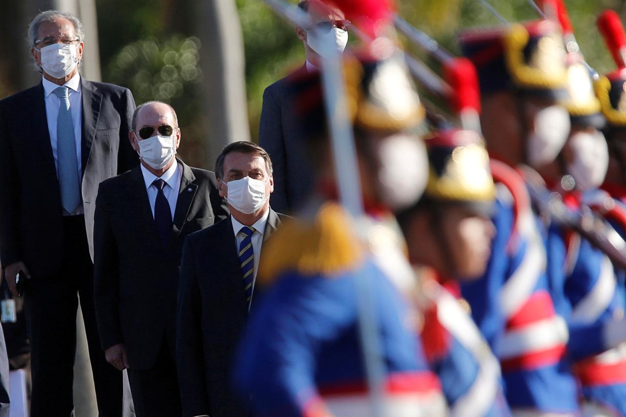 Brazil's President Jair Bolsonaro and other Brazil ministers attend a national flag hoisting ceremony in front of the Alvorada Palace, amid Covid-19 outbreak in Brasilia, Brazil, May 12. — Reuters