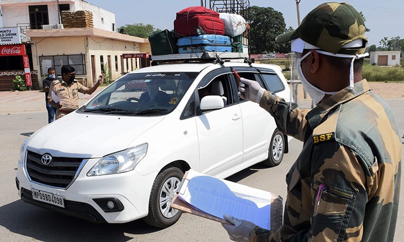 Border Security Force (BSF) personnel check the names of Pakistani nationals before returning to their country via the Wagah border. &mdash; AFP