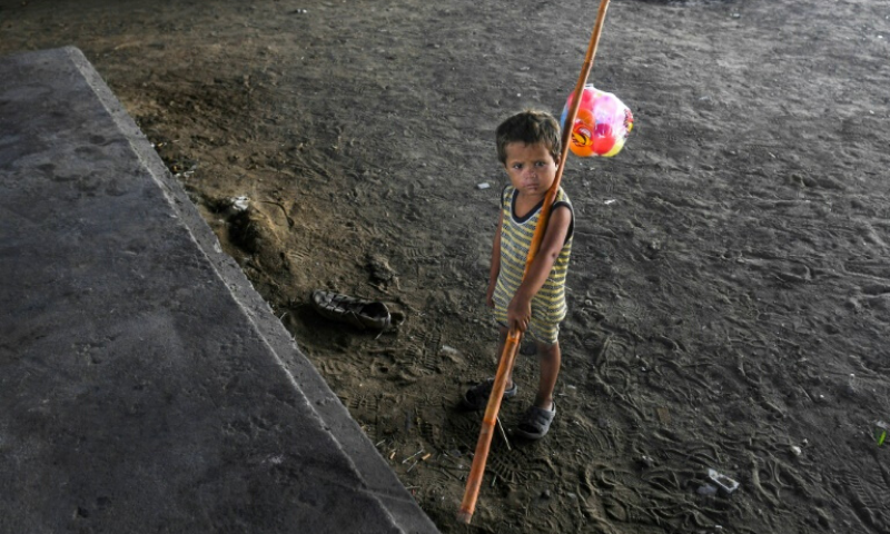 A child is seen in Karachi, Pakistan &mdash; the majority of children at risk of poverty live in South Asia and sub-Saharan Africa. &mdash; AFP