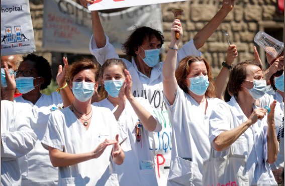 French health workers attend a demonstration in Paris. — Reuters