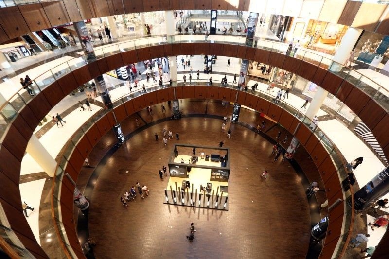 People shop at The Dubai Mall, in Dubai, United Arab Emirates, March 12. — Reuters