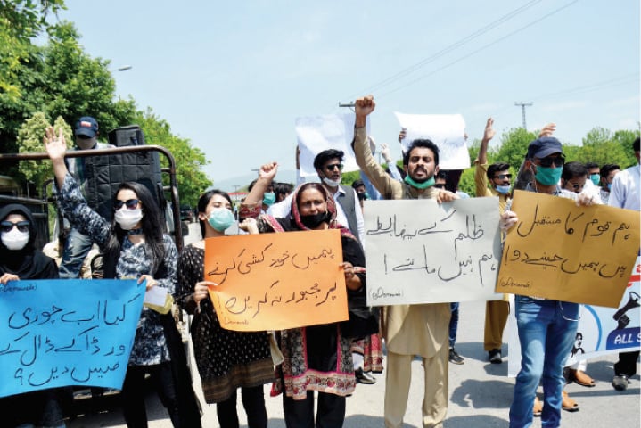 Students raise slogans during their protest outside HEC on Wednesday. — White Star