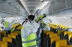 Workers wearing protective gear sanitise a Vueling's Airbus A321 passenger plane at Rome's international Fiumicino Airport. — Reuters