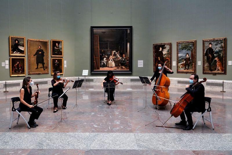 Musicians perfom next to Spanish artist Diego Velazquez's paintings as the Prado museum reopens in Madrid, Spain, June 6. — Reuters