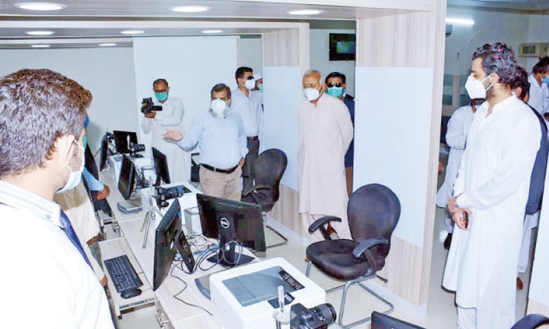 Federal Minister for Aviation, Ghulam Sarwar Khan visits the Nadra centre on Monday. &mdash; Dawn