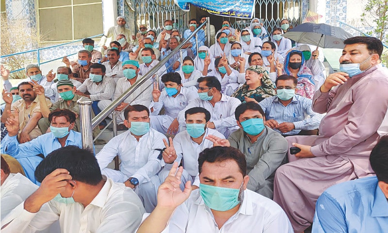 STRIKING doctors, paramedics and support staff hold a sit-in during a boycott of OPDs at Sukkur Civil Hospital on Saturday.—Dawn STRIKING doctors, paramedics and support staff hold a sit-in during a boycott of OPDs at Sukkur Civil Hospital on Saturday.—Dawn