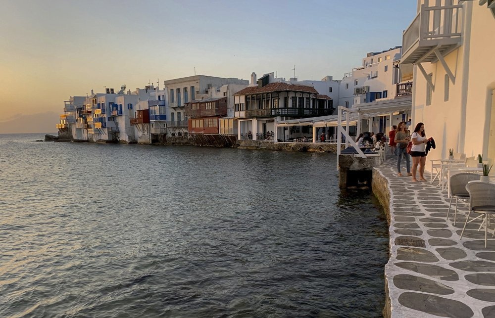 In this Tuesday, June 9 photo, visitors sit in bars in an area known as Little Venice on the Greek island of Mykonos. &mdash; AP