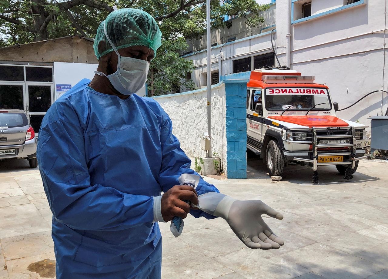 Mohammad Aamir Khan, an ambulance driver, wears his personal protective equipment (PPE) at a mortuary, before transporting bodies of people who died due to Covid-19, in New Delhi, India, June 8. &mdash; Reuters