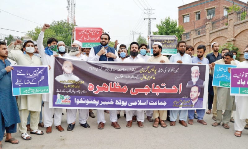 Jamaat-i-Islami workers stage a protest outside Peshawar Press Club on Wednesday against torture of youth by police. — White Star