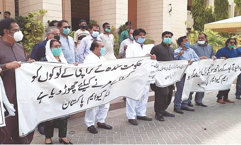 MQM lawmakers hold a protest outside the Sindh Assembly building on Thursday.—PPI MQM lawmakers hold a protest outside the Sindh Assembly building on Thursday.—PPI