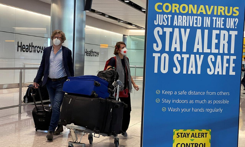 Passengers arrive at Heathrow Airport, as Britain launches its 14-day quarantine for international arrivals, following the outbreak of the coronavirus on June 8. &mdash; Reuters