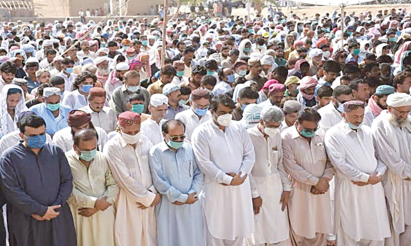 FUNERAL prayer of Haji Munawwar Ali Abbasi under way in a playground in Larkana on Saturday.—Dawn FUNERAL prayer of Haji Munawwar Ali Abbasi under way in a playground in Larkana on Saturday.—Dawn