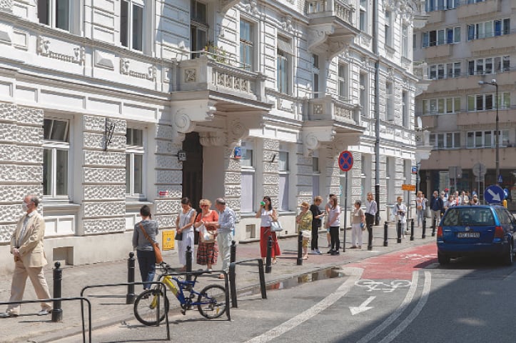 Warsaw: People wearing face masks observe mandatory social distancing against the spread of the coronavirus as they wait in line to cast their votes in Poland’s presidential election on Sunday.—Reuters