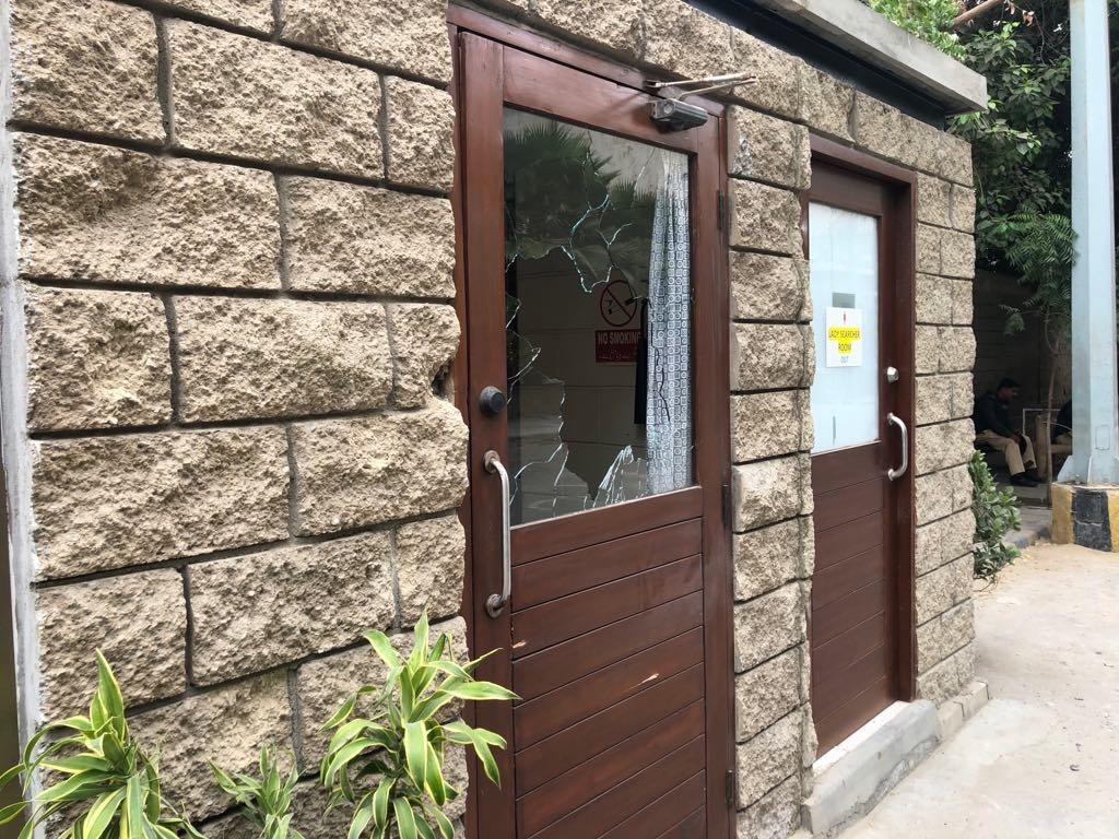 A broken glass at the entrance to the PSX compound. — Photo: Shahzeb Ahmed