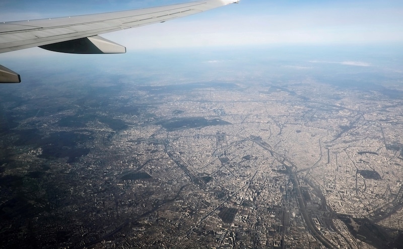 An aerial view through the window of a passenger aircraft shows the city of Paris, France, February 13, 2019. &mdash; Reuters/File